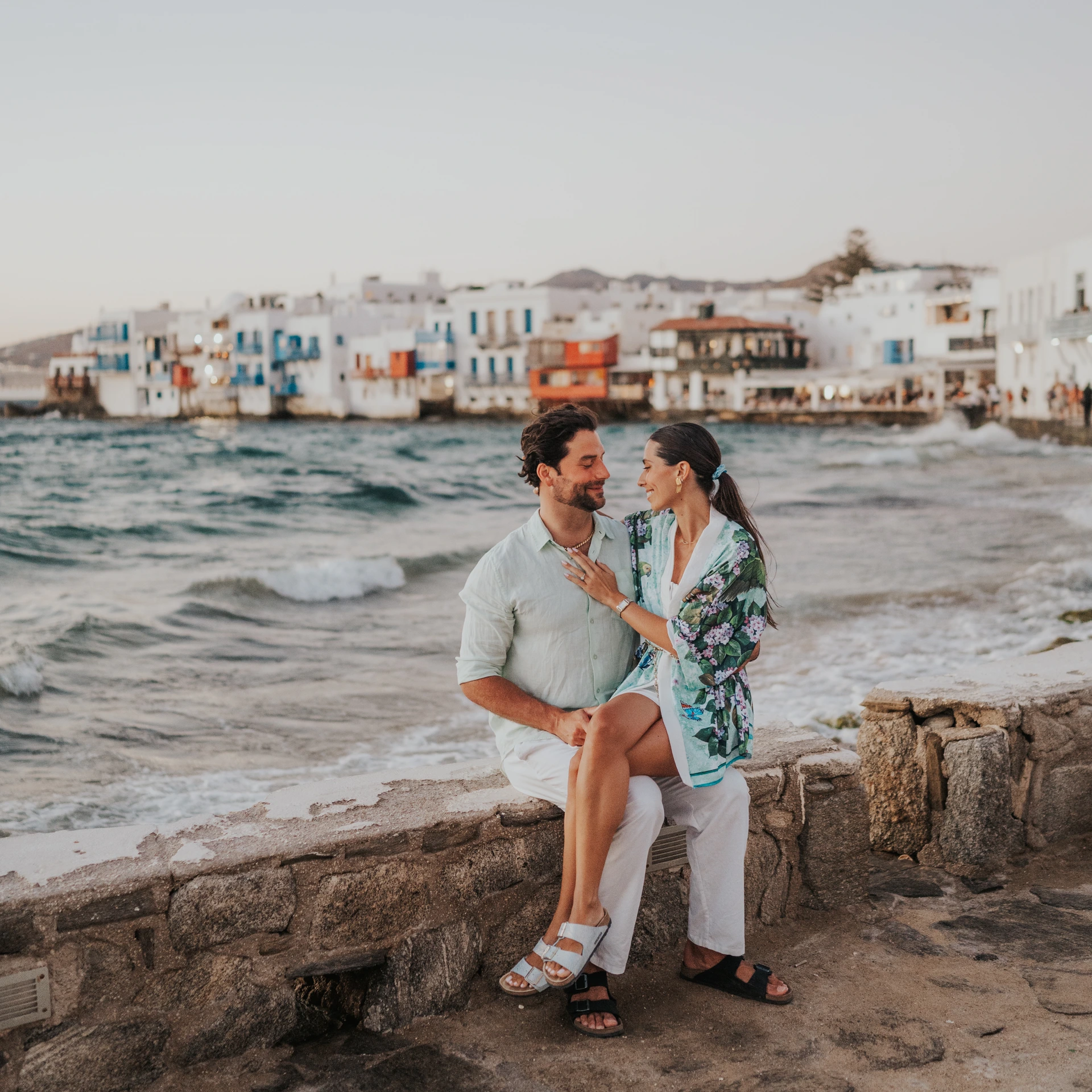 Couple on the waterfront in Little Venice, Mykonos