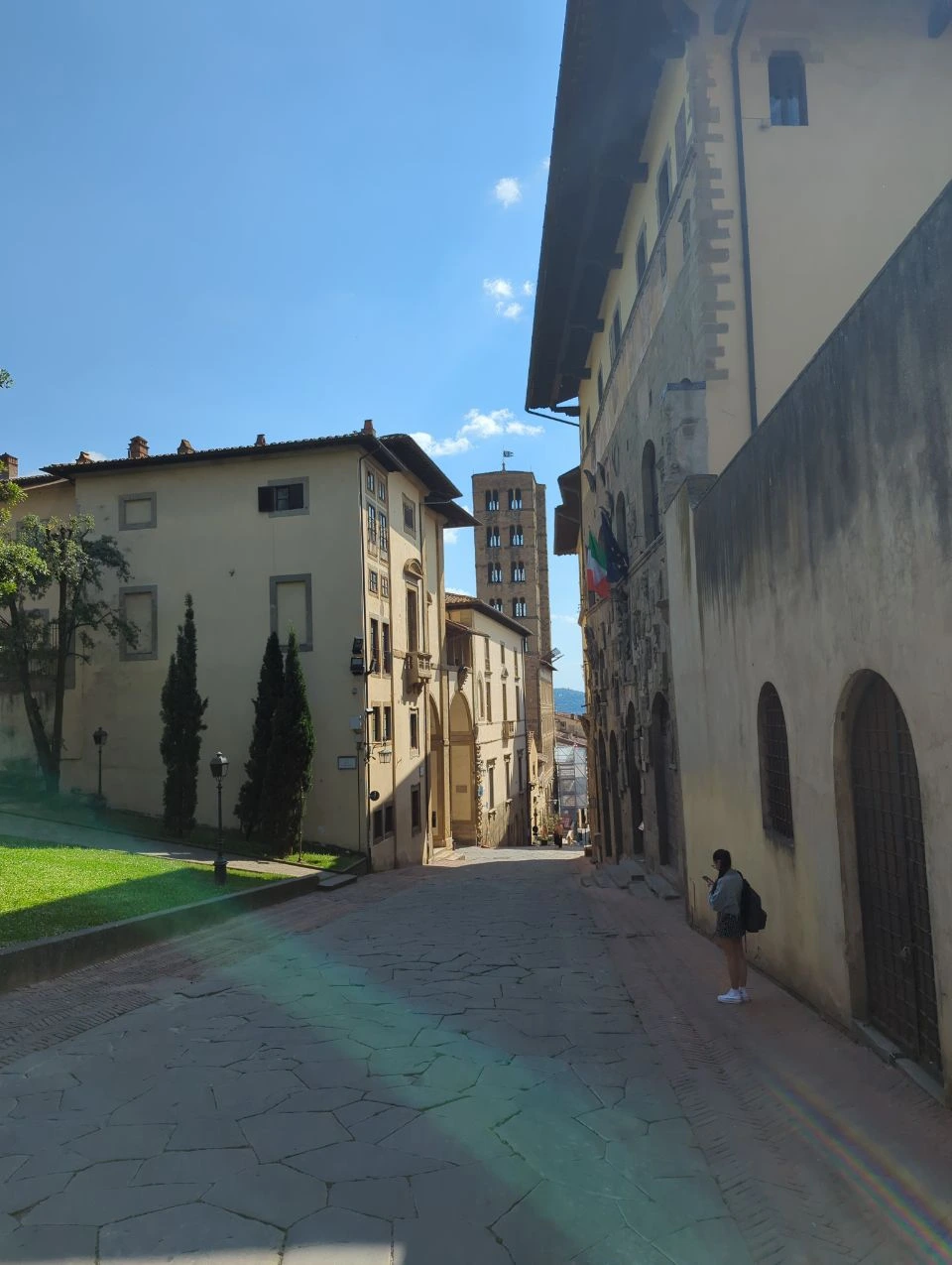 Stone buildings and a tower at the end of Via dell’Orto in Arezzo