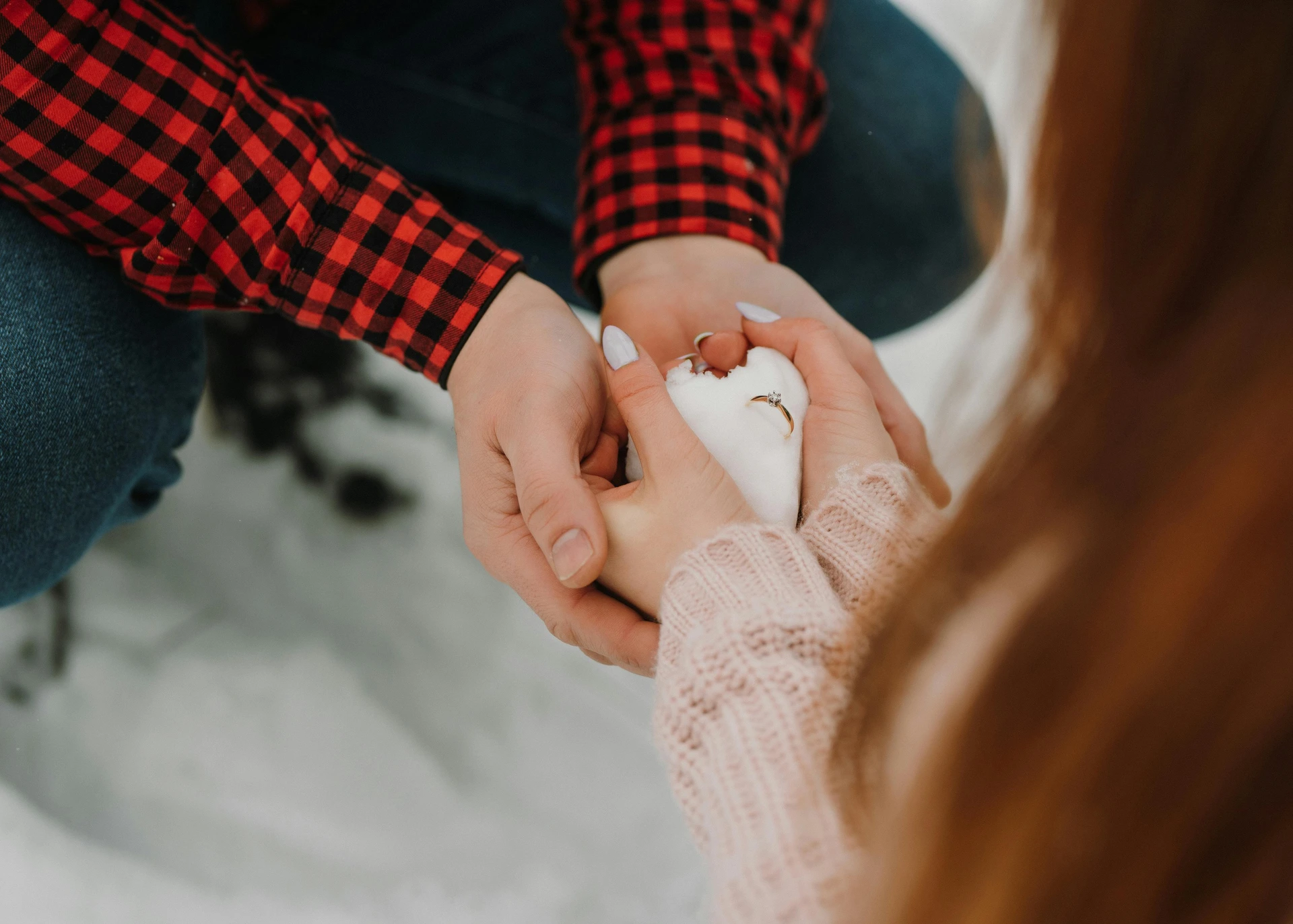 Couple during a proposal moment, for the 6 Winter Proposal Locations Around the World guide.