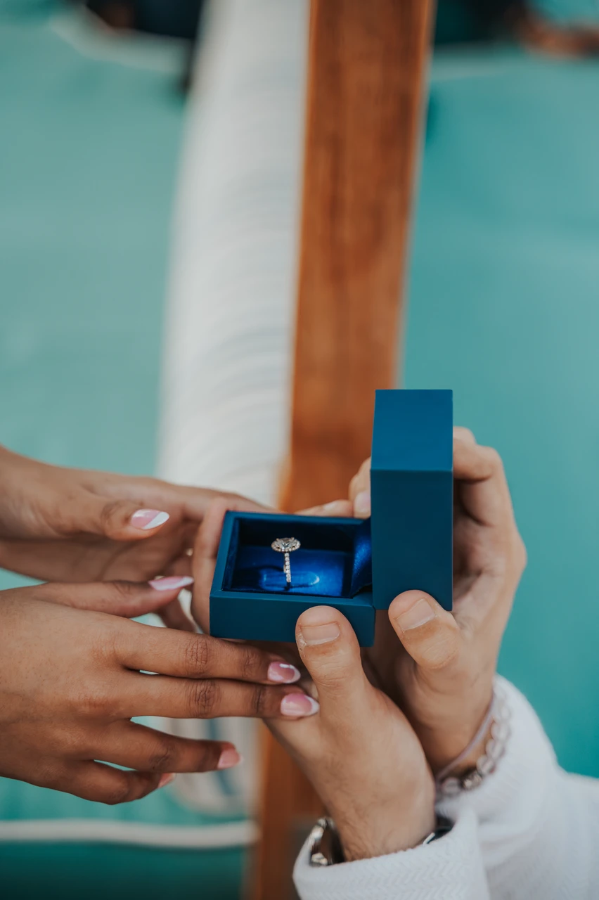 Abra Proposal at Souk Madinat Dubai - Ring Close-Up Detail Close-up of an engagement ring in a box held by the couple during an abra proposal at Souk Madinat.