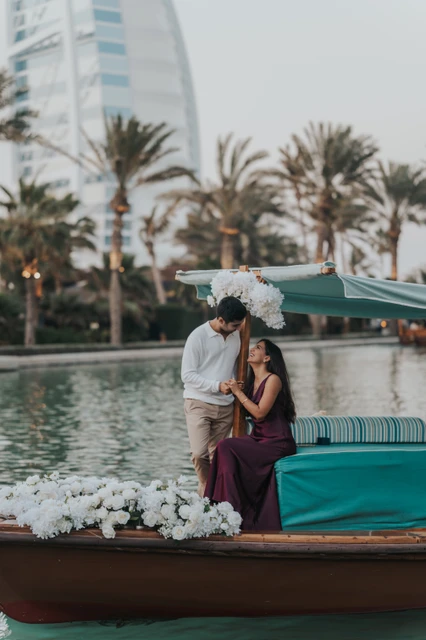 Abra Proposal at Souk Madinat Dubai - Intimate Boat Moment An intimate couple moment on an abra decorated with white flowers at Souk Madinat Dubai.