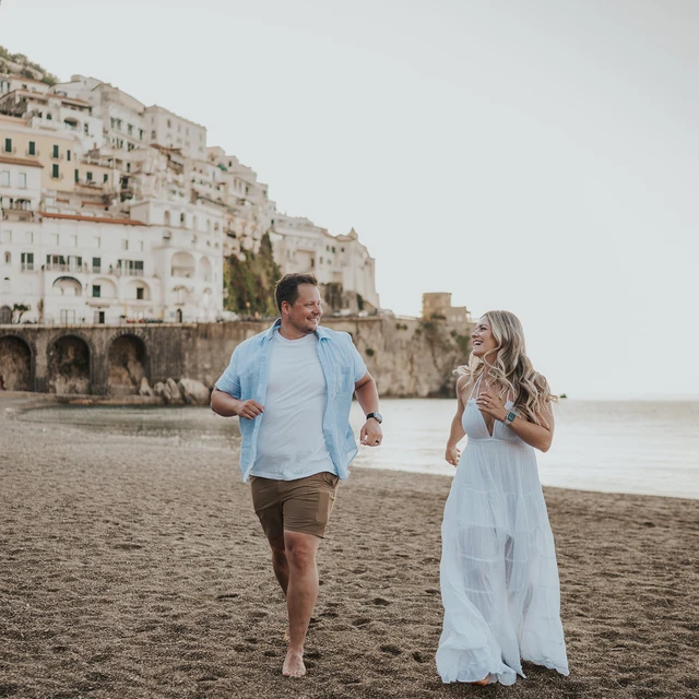 Couple walking on Amalfi beach