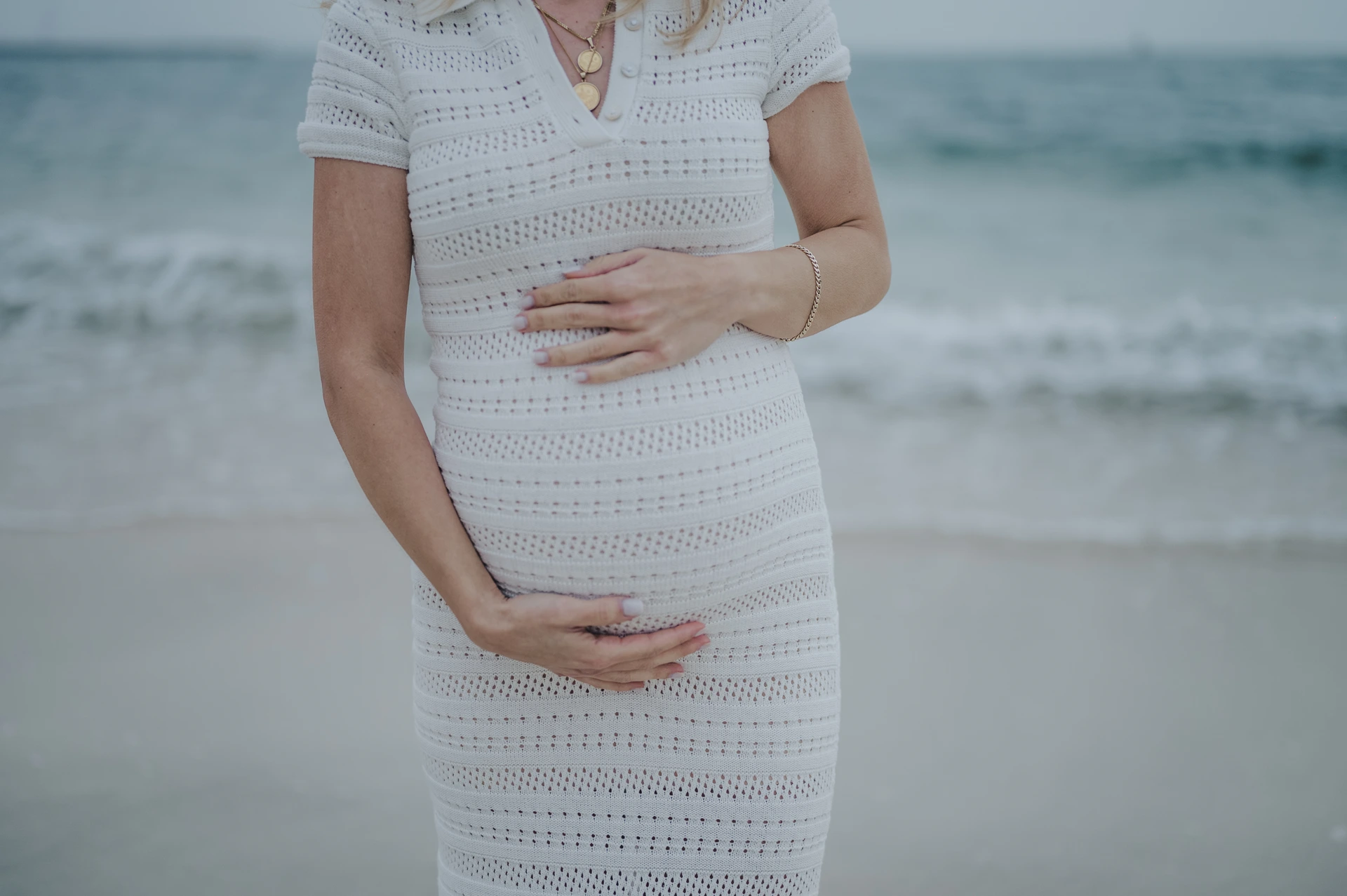 Pregnant woman on Dubai beach for babymoon photoshoot