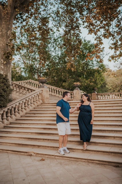 A portrait beside the park staircase | Barcelona family photoshoot The parents standing together in front of the broad stone staircase during their family photoshoot in Barcelona.