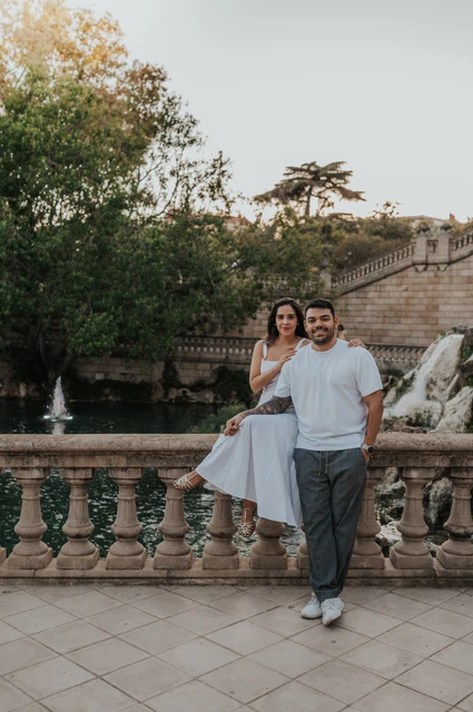Portraits beside the waterfall balustrade | Barcelona engagement photoshoot The couple posing by the carved balustrade with the waterfall and fountain architecture behind them during their engagement photoshoot in Barcelona.