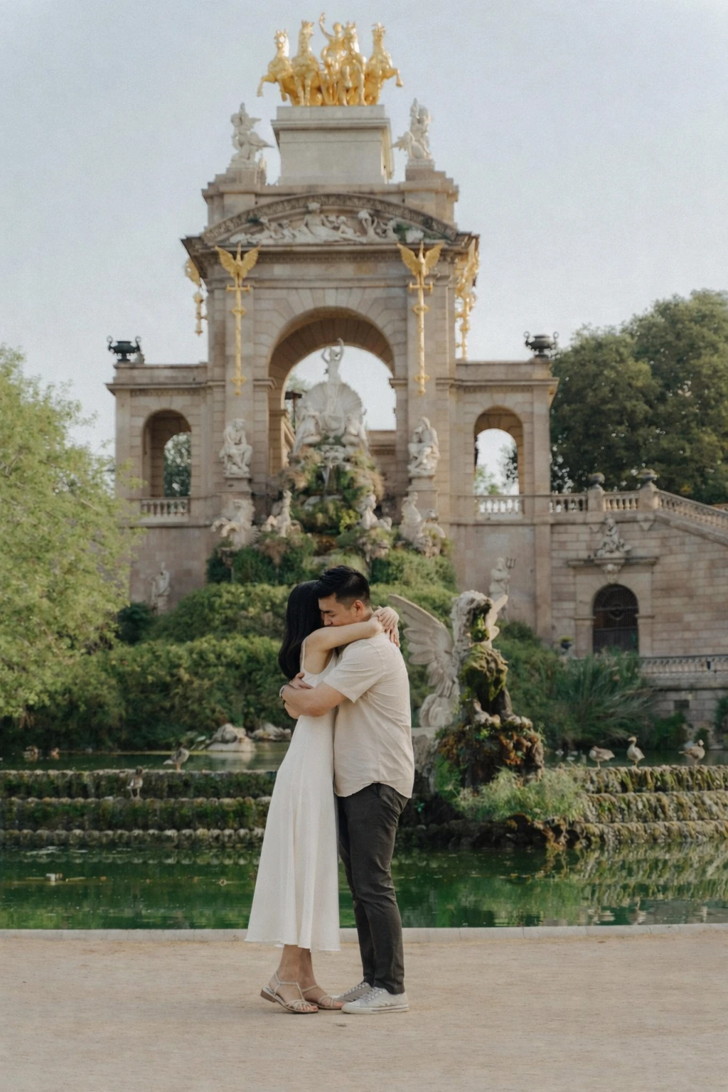 Newly engaged couple by the Cascada Monumental in Barcelona