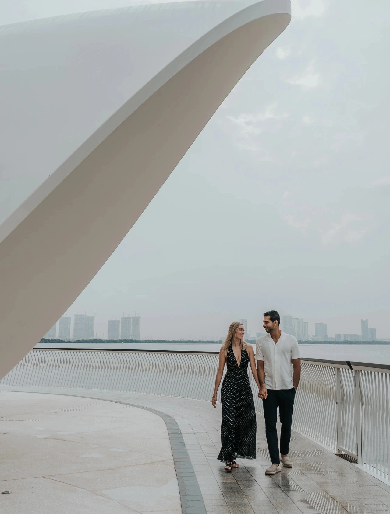 Couple walking hand in hand during candid motion photoshoot in Dubai