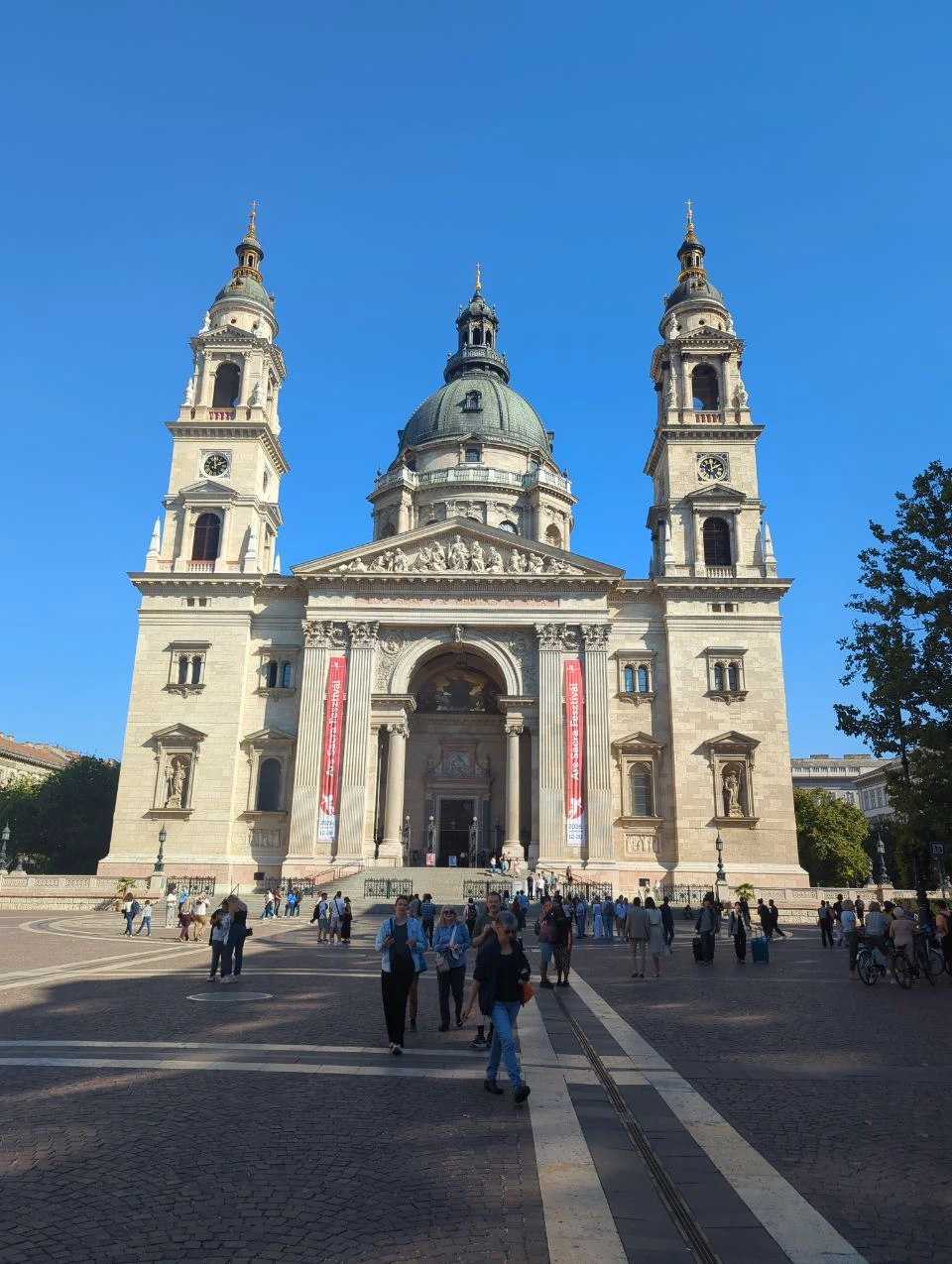 St Stephen's Basilica front square Front façade of St Stephen's Basilica across a busy sunlit square