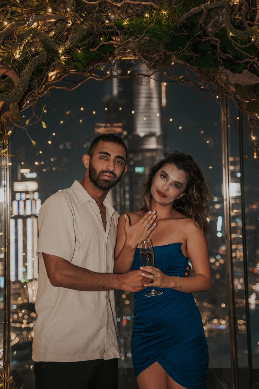 CE LA VI rooftop proposal Dubai - Ring Reveal Toast A couple celebrates their CE LA VI rooftop proposal in Dubai as the bride-to-be shows her ring and holds a champagne flute.