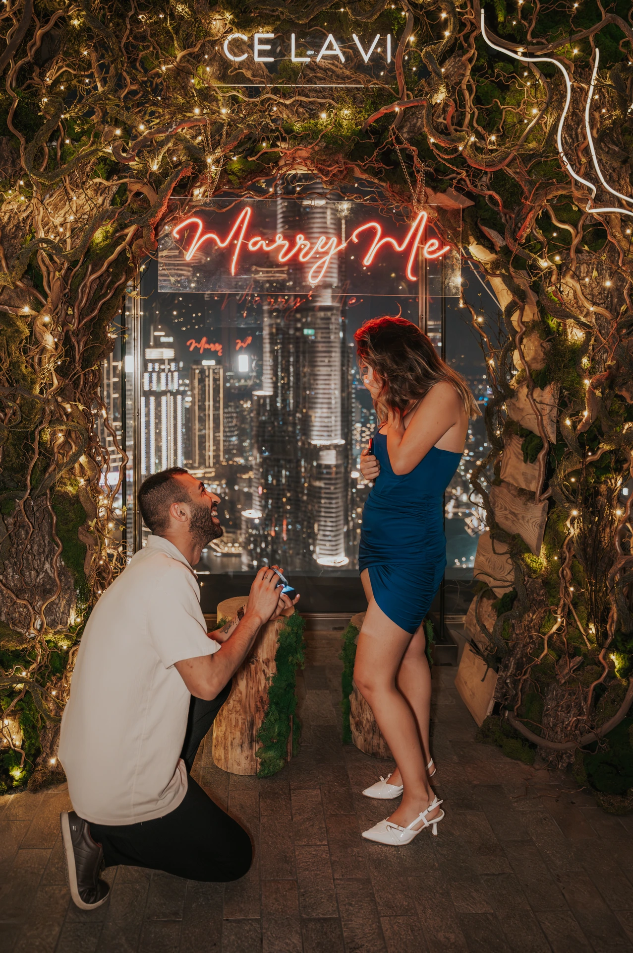 Couple proposing at CE LA VI Rooftop Dubai with a beautiful backdrop with the Burj Khalifa