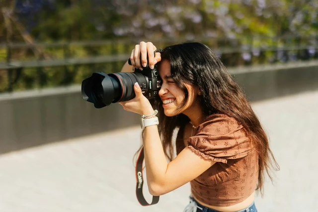 Charlotte photographer Charlotte photographing with a camera outdoors