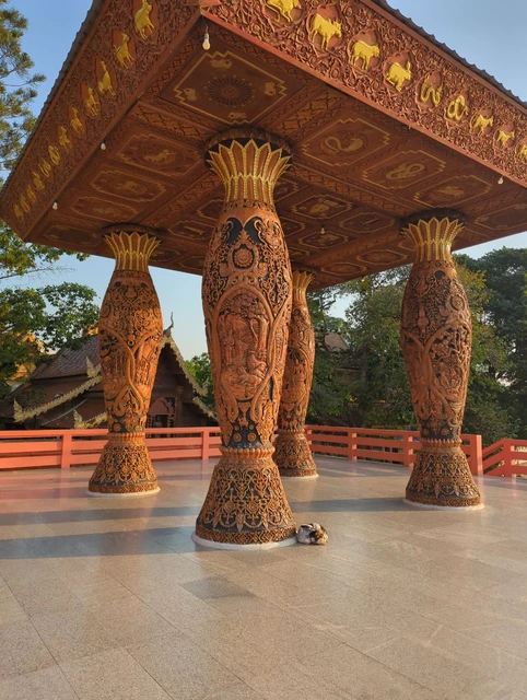 Carved red and gold pavilion columns at Doi Suthep