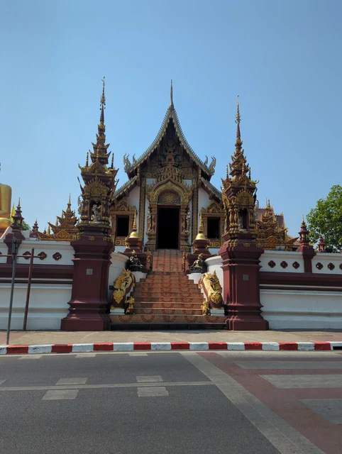 Ornate entrance and stairs at Wat Rajamontean in Chiang Mai