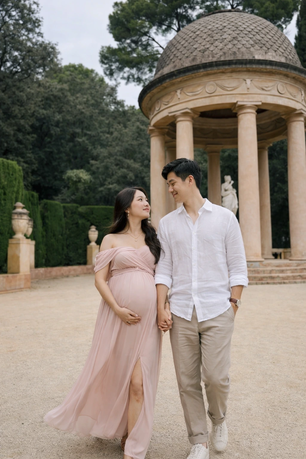 Barcelona park maternity photoshoot Expectant couple walking in a Barcelona park during a maternity photoshoot