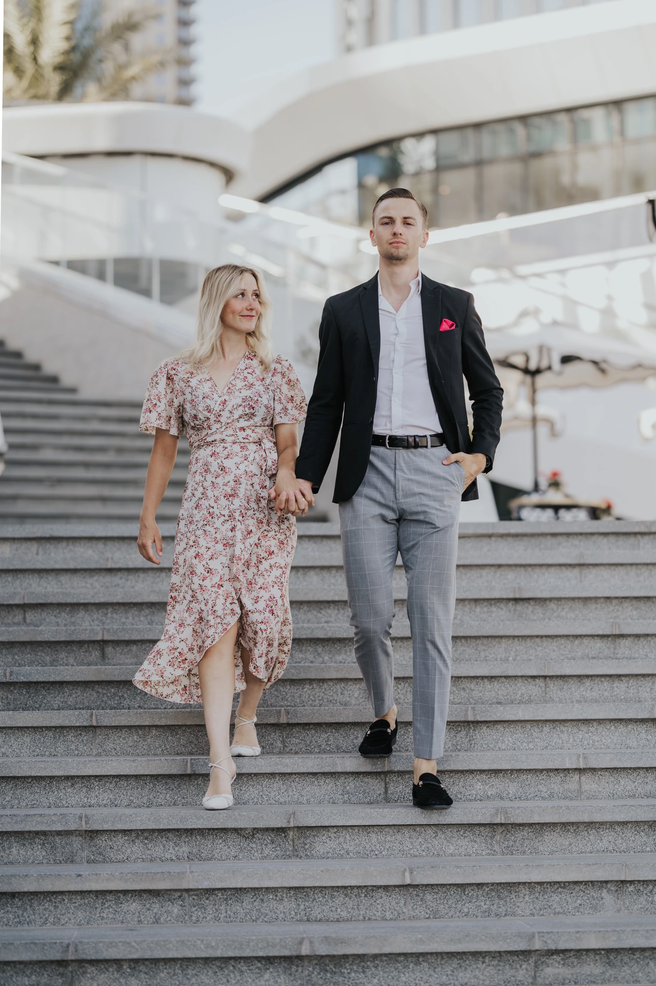 Couple photoshoot on Creek Harbour Dubai steps in daylight
