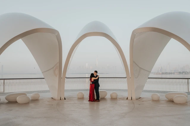 Couple embracing at Creek Harbour Dubai arches