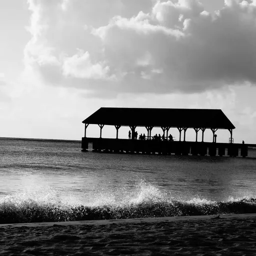 Beach Pier Pavilion Silhouette Black and White Black and white silhouette of beach pavilion pier with people against ocean and cloudy sky