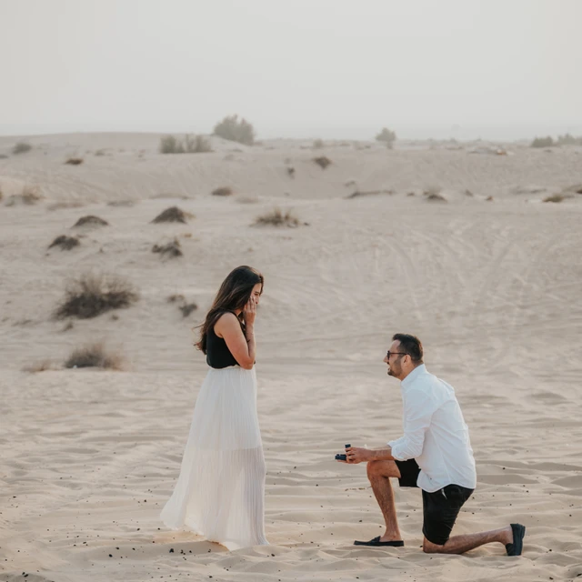 Desert proposal Dubai Desert proposal in Dubai with couple overlooking the desert