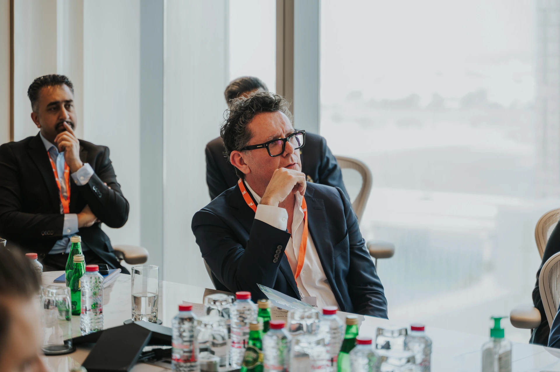 Business event in Dubai being captured by an event photographer whilst a person is listening to a speech