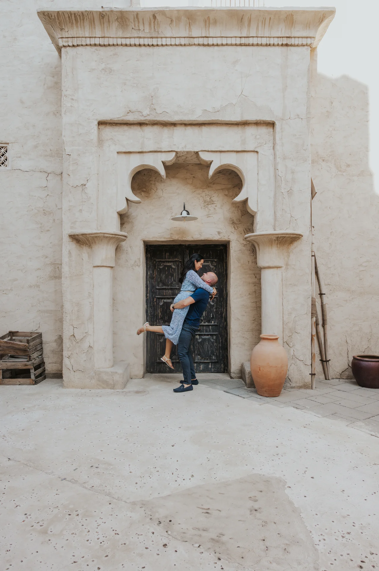 Dubai photographer photographing a couple in old Dubai, Al Seef