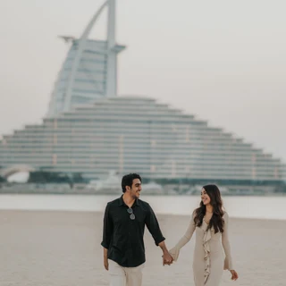 Dubai picnic proposal Couple walking hand in hand after their proposal with a picnic
