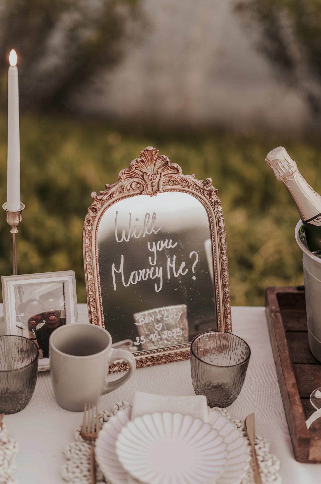 Image of a mirror with will you marry me written on it for a picnic proposal in Dubai