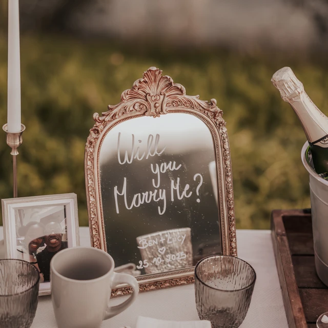 Dubai picnic proposal Image of a mirror with will you marry me written on it for a picnic proposal in Dubai