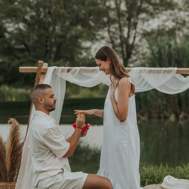 A couple looking at eachother being photographed by a Dubai Photographer in the desert. Dubai Photographer