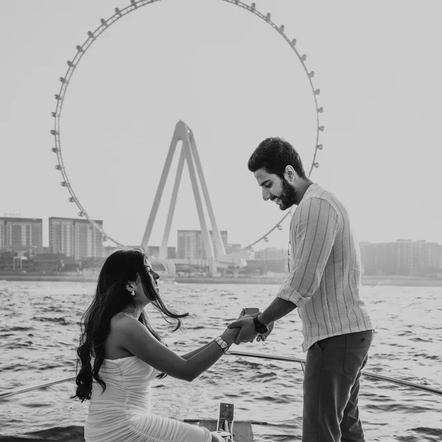 Dubai Proposal Photographer Couple being photographed by a Dubai proposal photographer while they are in front of the Ain Dubai.