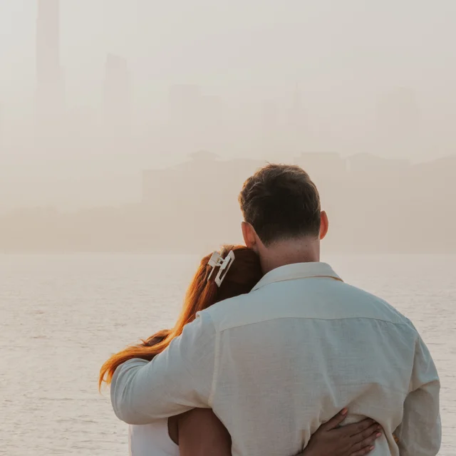 Dubai proposal photographer Couple holding eachother tightly after she said yes to the proposal, the photographer captured the essence of love and connection.