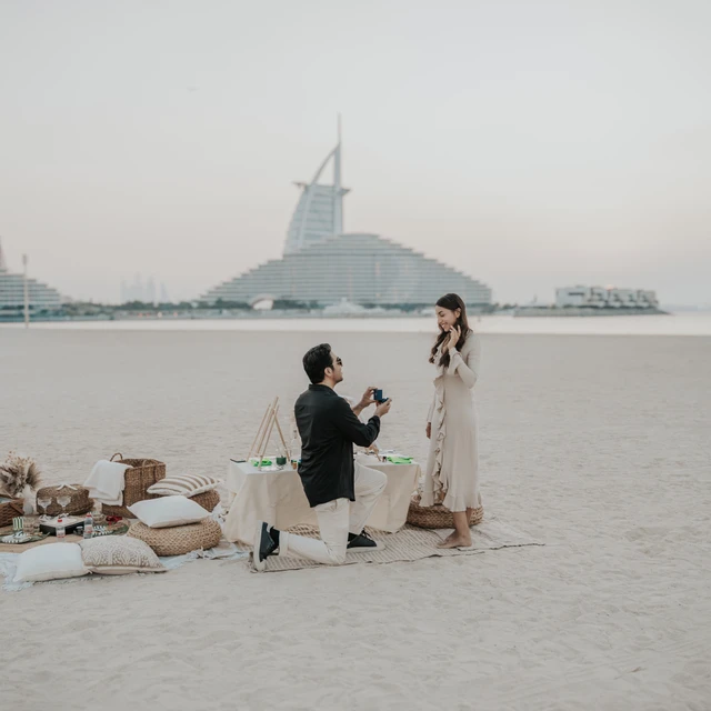 Dubai Proposal Photographer Image of couple that just proposed in the dunes in Dubai captured by a Dubai photographer.