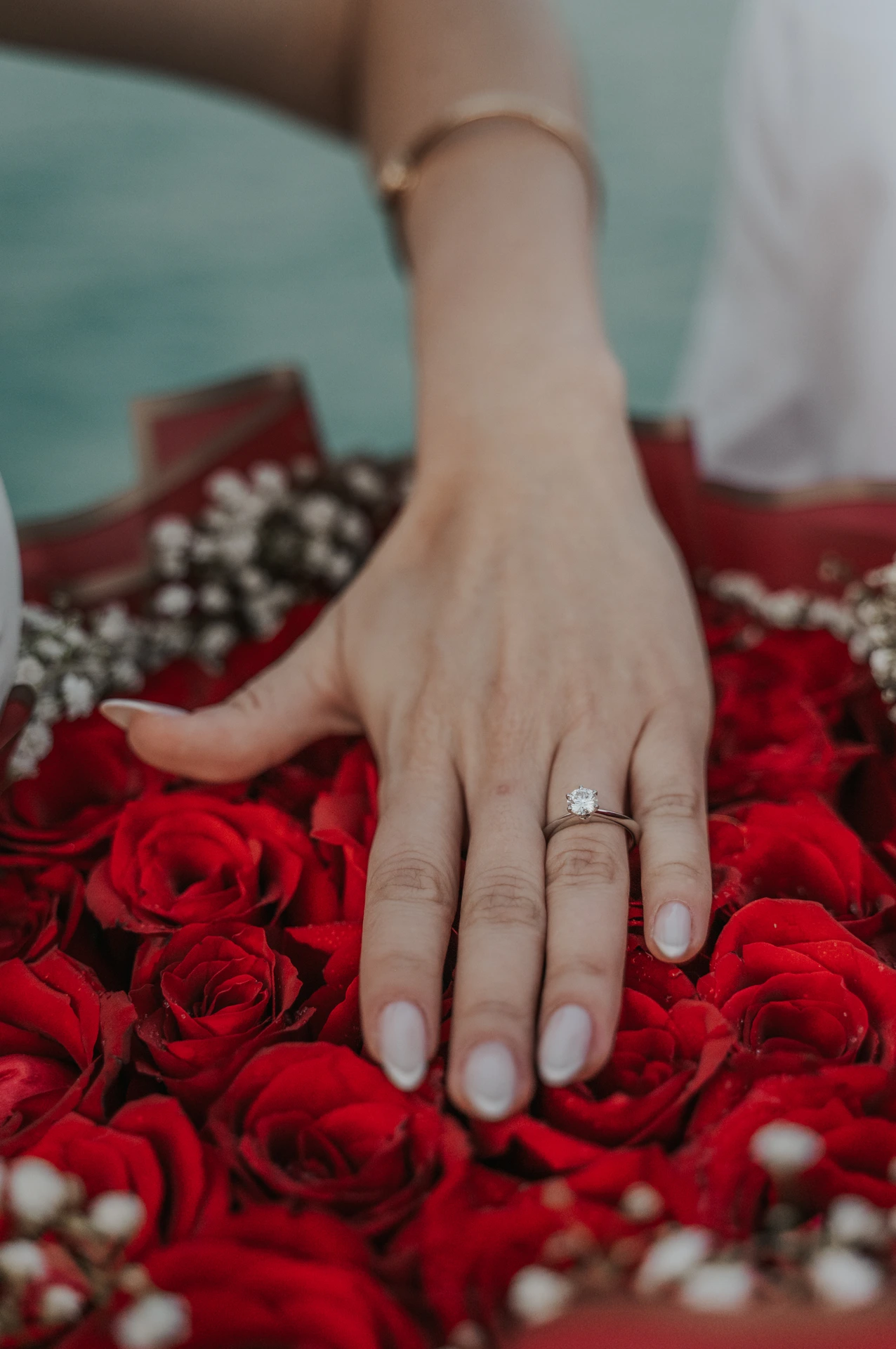 Image of couple that just proposed in the dunes in Dubai captured by a Dubai photographer.