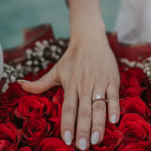 Dubai Proposal Photographer Image of couple that just proposed in the dunes in Dubai captured by a Dubai photographer.