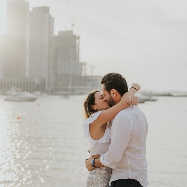 Dubai Proposal Photographer Image of couple that just proposed in the dunes in Dubai captured by a Dubai photographer.