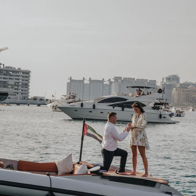 Dubai Proposal Photographer Couple proposing on a boat in Dubai