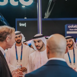 Multiple cultures being photographed at an event in Dubai by a photographer
