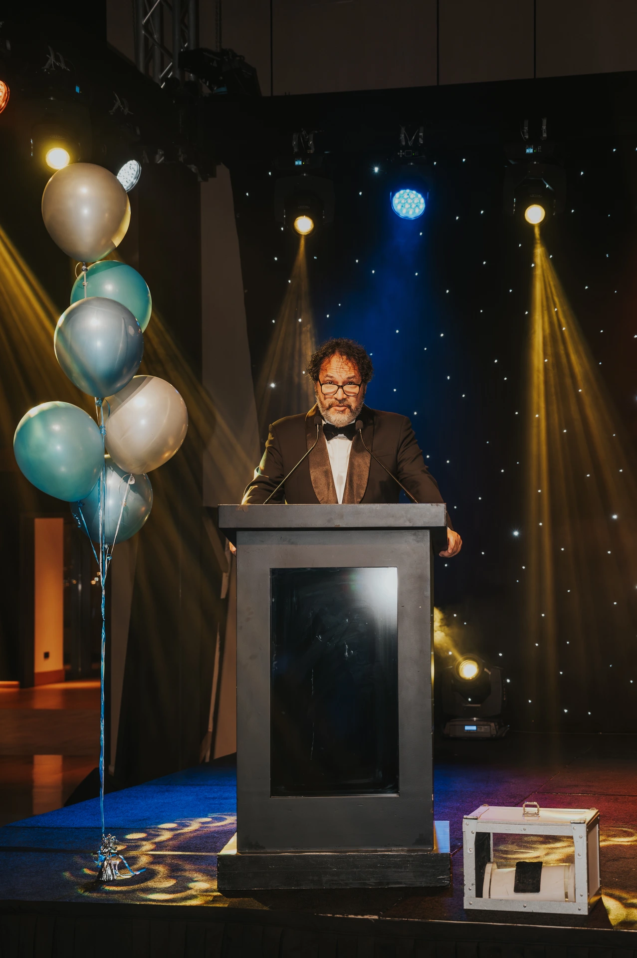 Event photographer Dubai Photography of a business event in Dubai with a keynote speaker at center stage