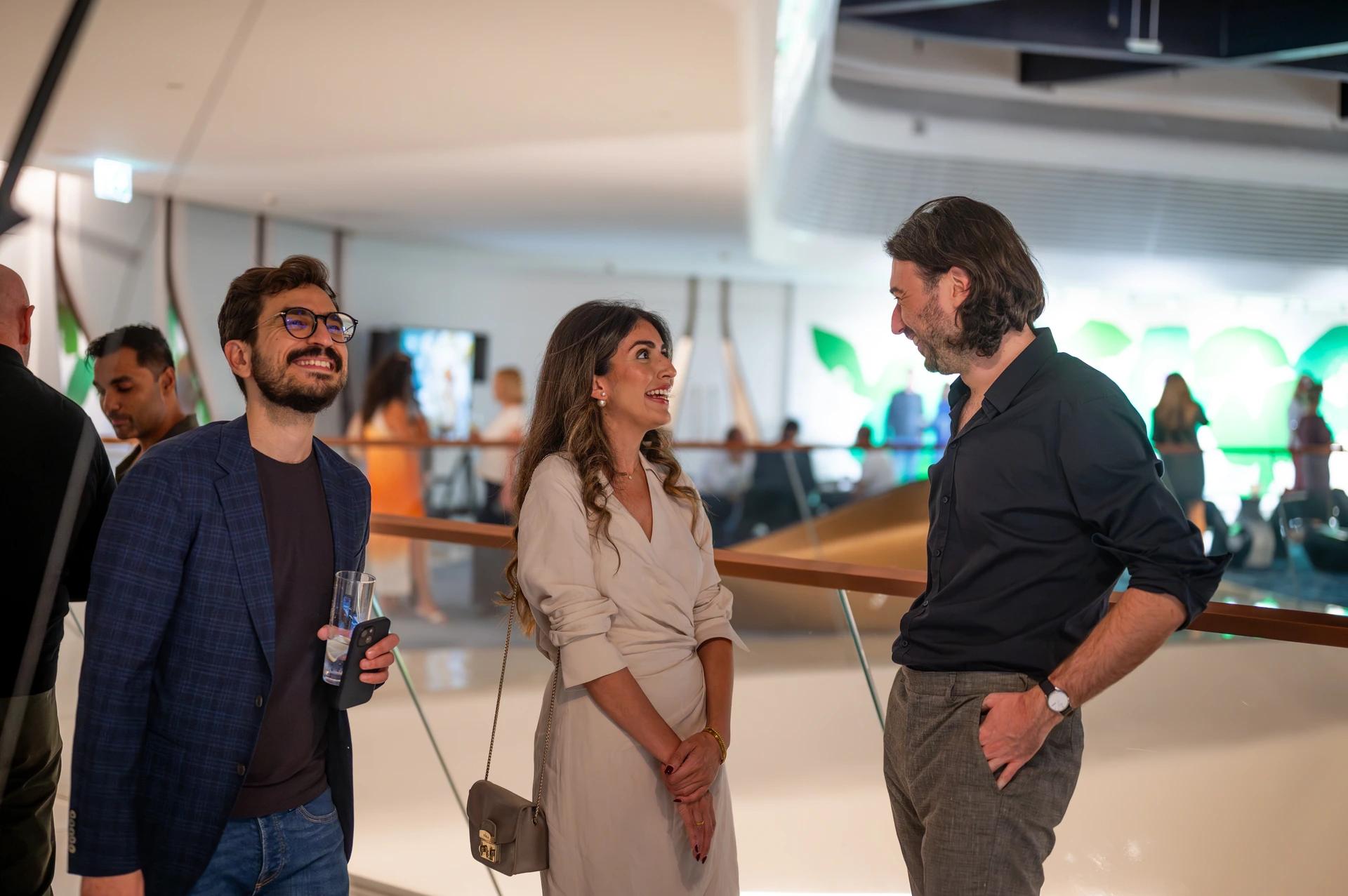 Event photographer Dubai People talking at an event in Dubai being captured by a Dubai event photographer