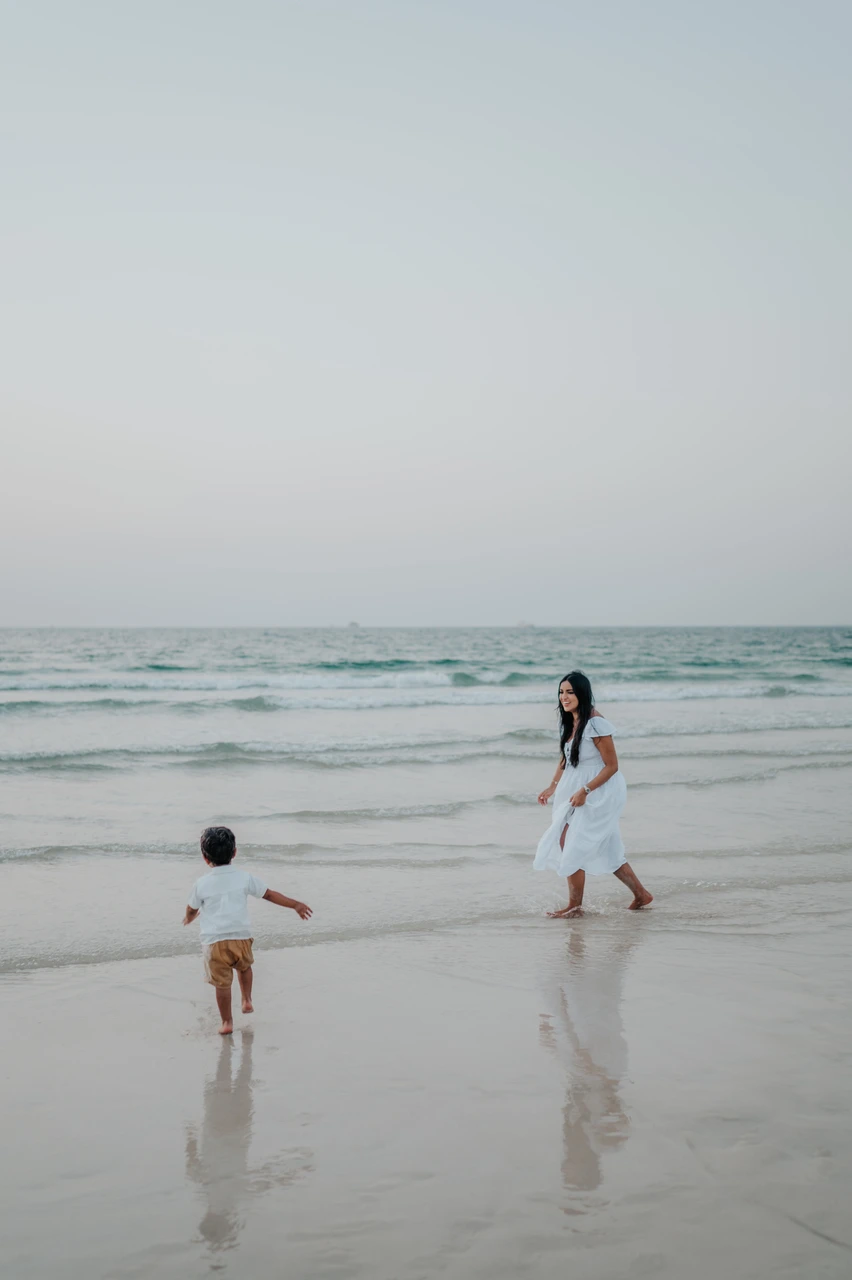 Mother and child playing on the beach in Dubai Mother and child playing on the beach in Dubai