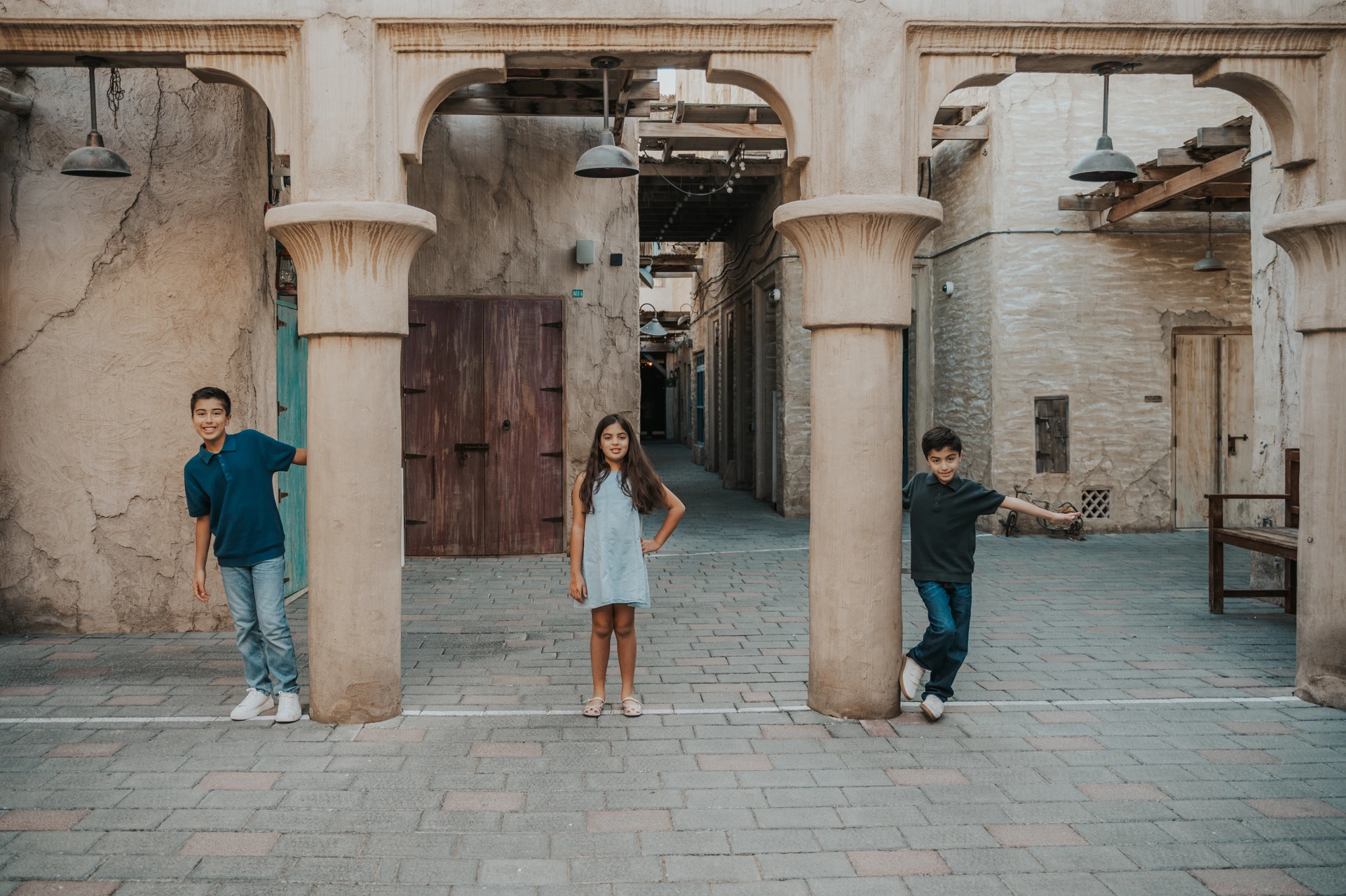 Children in Old Dubai souk area during a family holiday