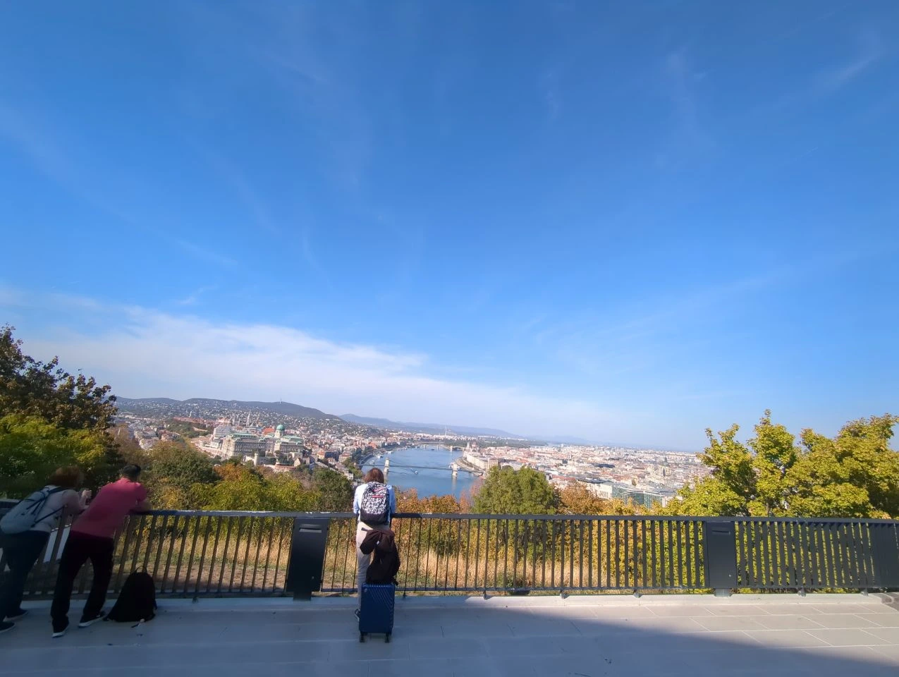 Gellért Hill pale-paved lookout Pale paving and metal railing at a Gellért Hill lookout, with visitors and the Danube beyond