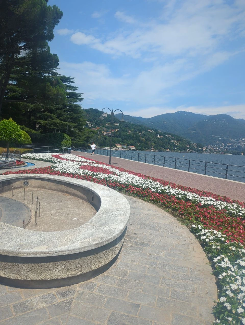 Fountain basin and flower beds beside Lake Como