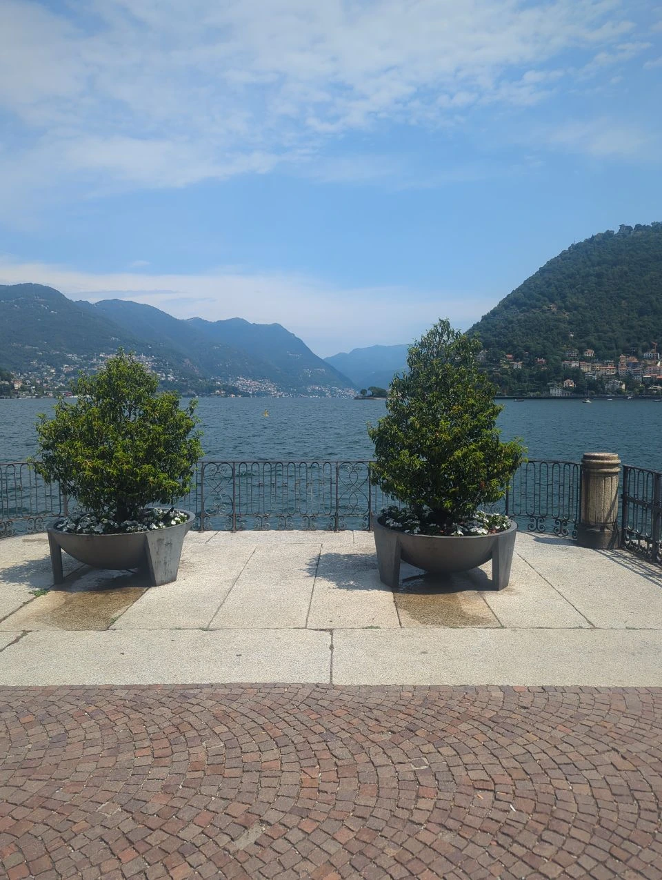 Potted trees on a lakeside terrace at Lake Como