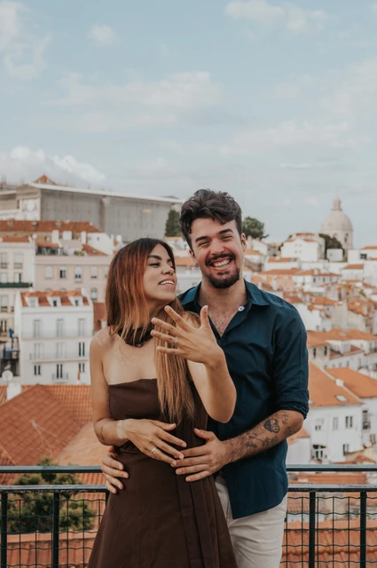 A close portrait with the engagement ring | Lisbon engagement photoshoot A close portrait of the couple showing her engagement ring at Portas do Sol during their engagement photoshoot in Lisbon.