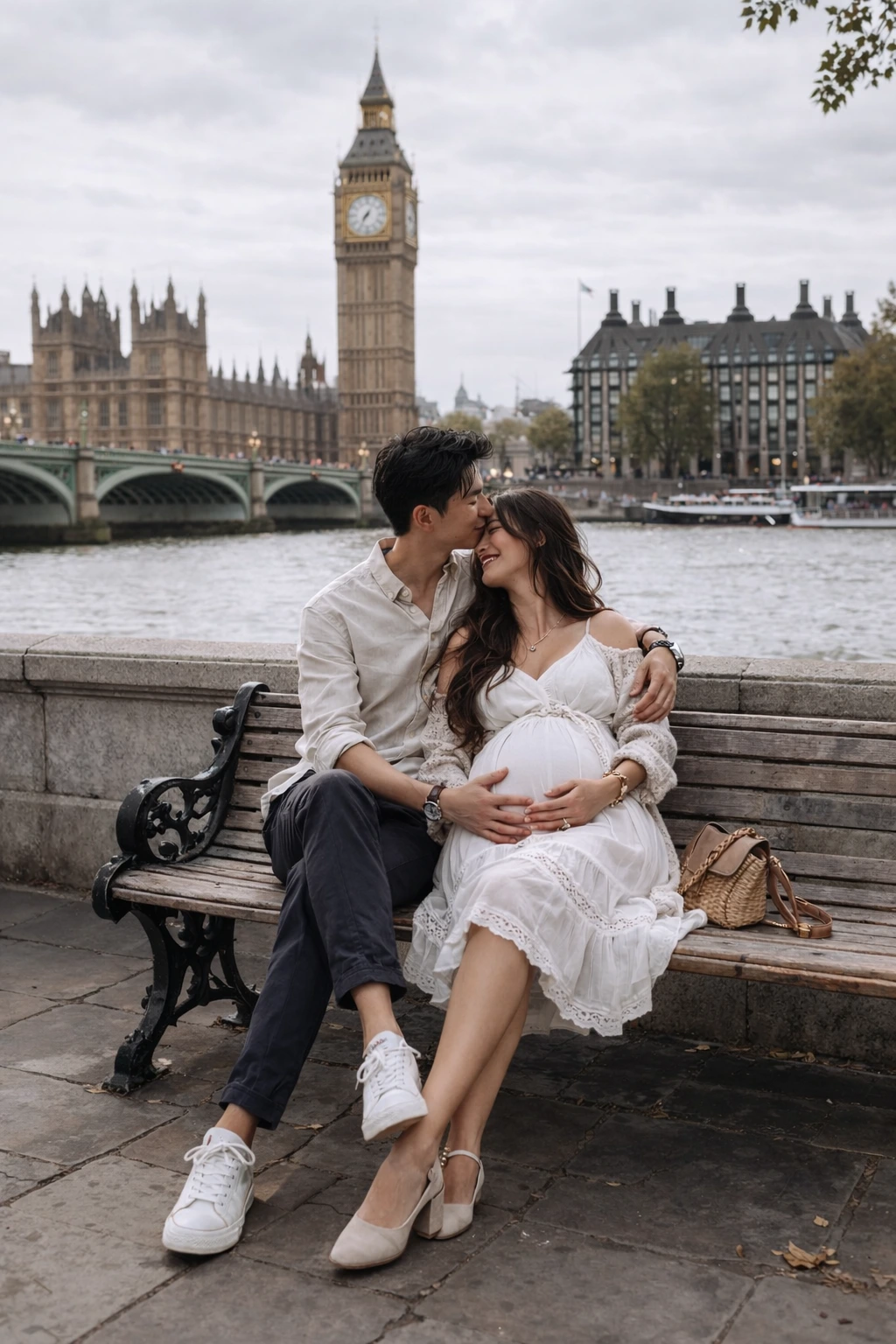 Pregnant woman sitting on rocks during outdoor maternity photoshoot in London
