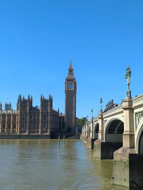 Elizabeth Tower and the Houses of Parliament across the Thames beside Westminster Bridge