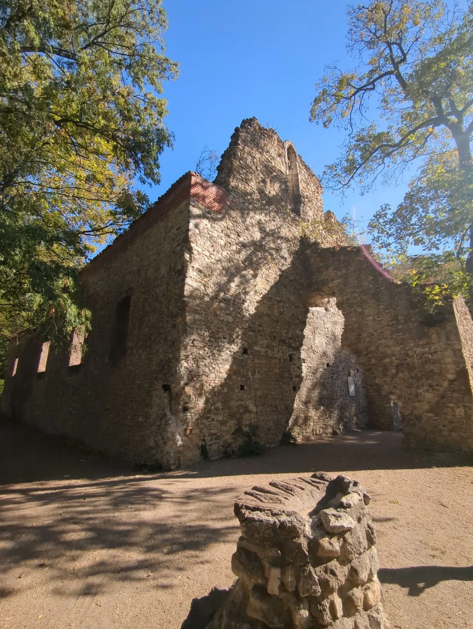 Tall roofless walls and arch of the Franciscan church ruins on Margaret Island