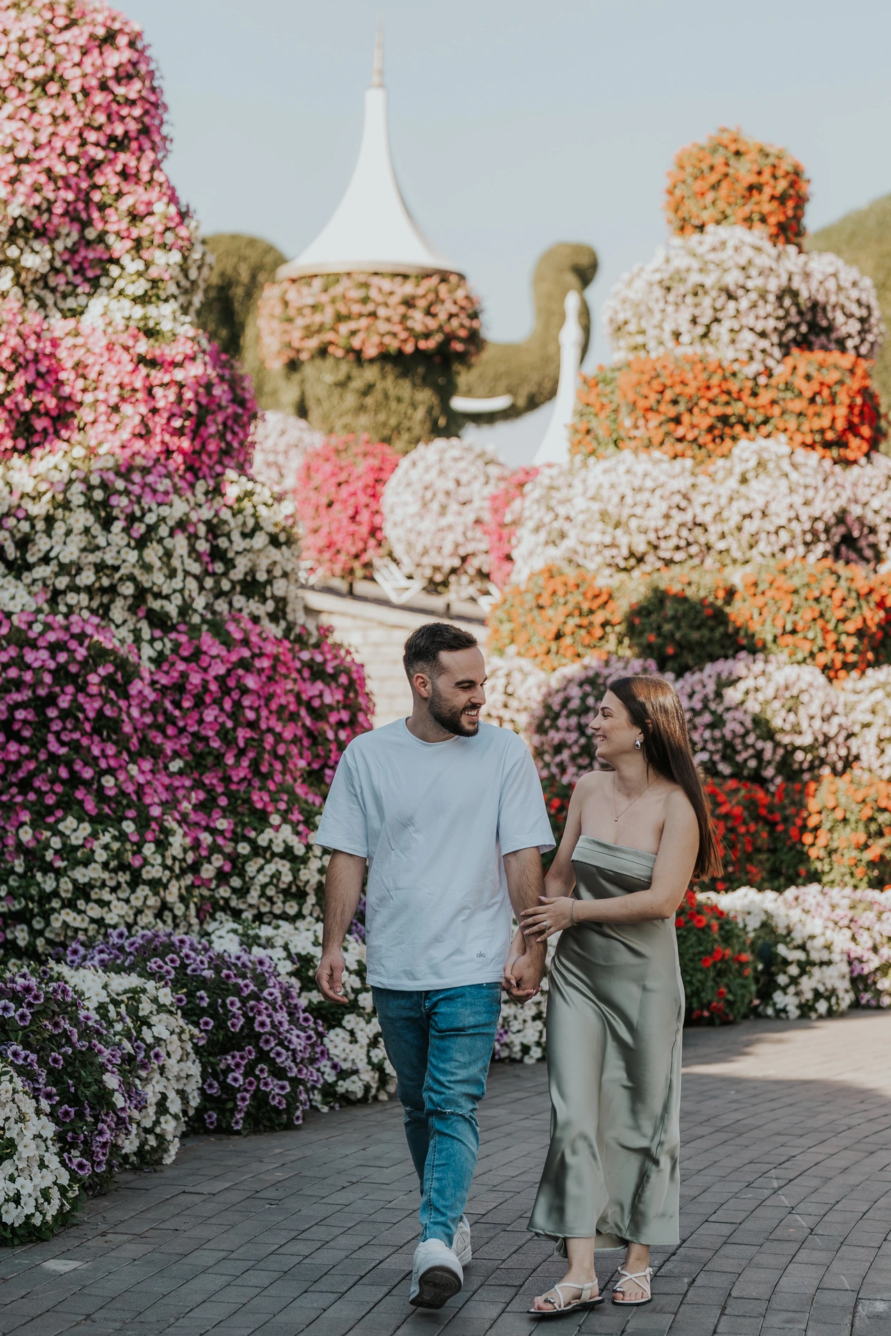 A proposal setup in Dubai Miracle Garden with floral backdrops that create a soft, romantic engagement atmosphere.
