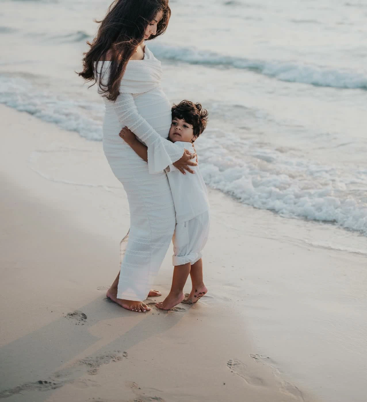 Mother and children smiling during a Mother’s Day session