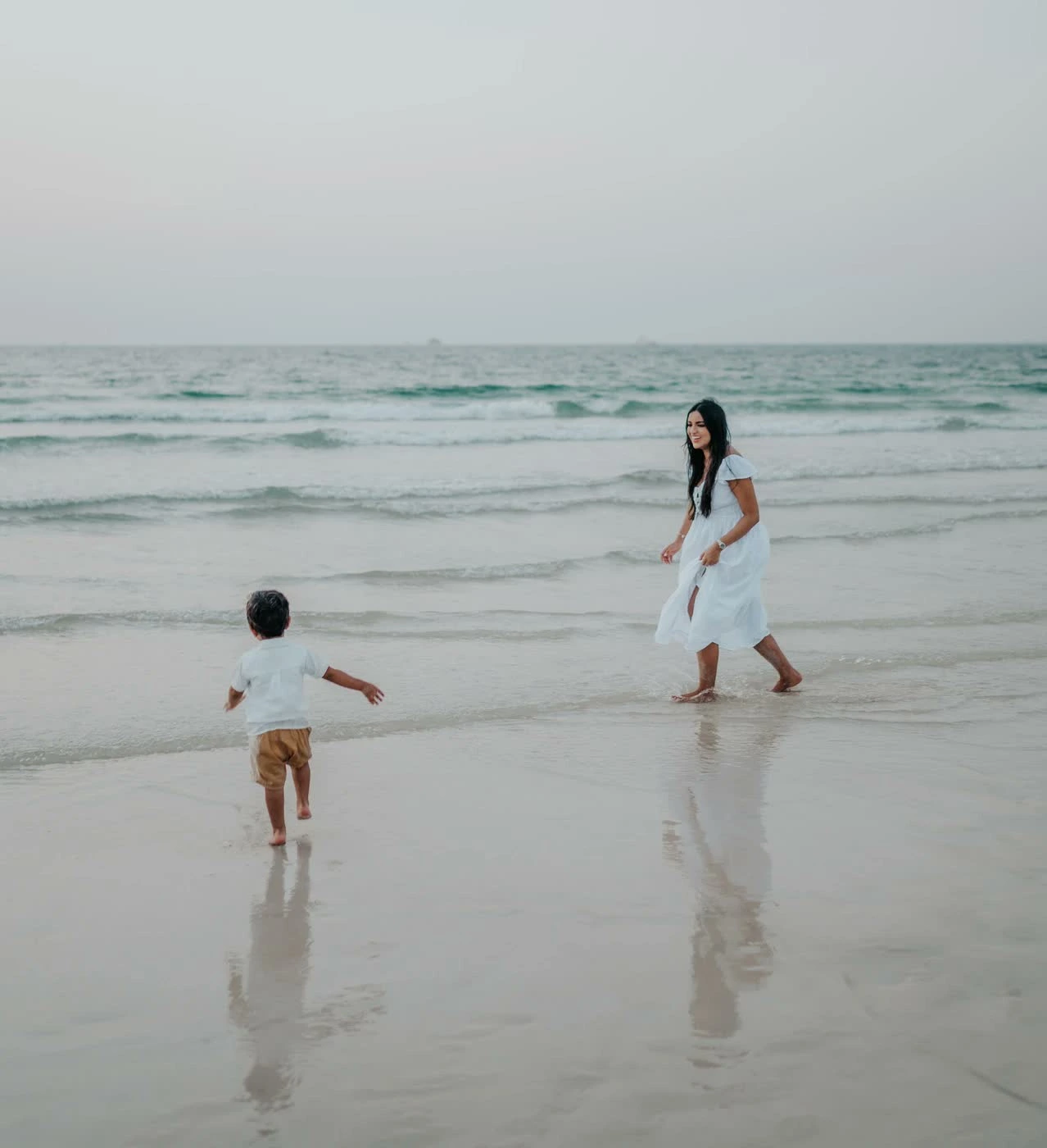 Mother with children smiling together during photoshoot